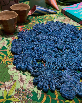 woven round placemat in blue